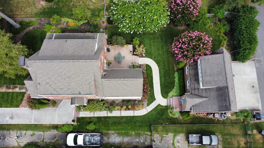 Aerial view of customer's home while inspection roof